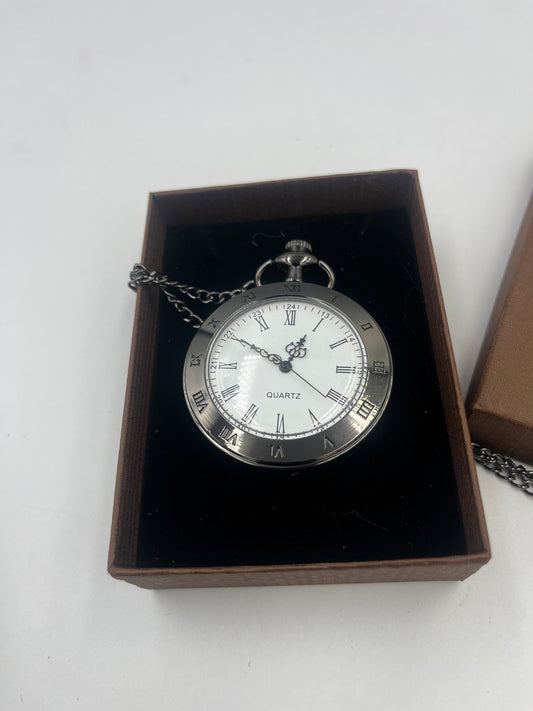 Black Vintage style pocket watch with Roman numerals.