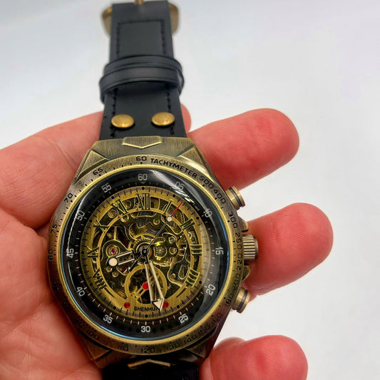 Premium Steampunk Mens wristwatch with mechanical movement and genuine leather strap.